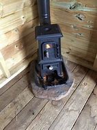 Image result for Mini Wood Stoves for Cabins