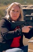 Image result for Marjorie Taylor Greene with Gun