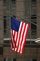 Image result for American Flag Hanging Vertically On House