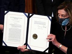 Image result for Nancy Pelosi Signing Pens Celebration