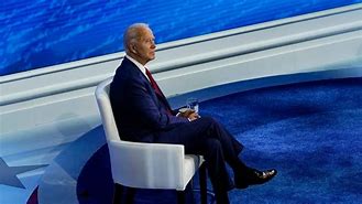 Image result for Biden Sitting Down at a Table