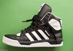 Image result for Black Adidas with Yellow Stripes