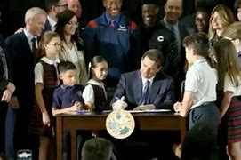 Image result for DeSantis signs biggest school voucher bill in Florida 
