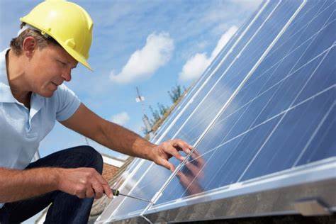 Man installing solar panel