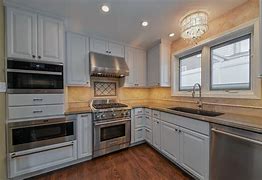 Image result for White Kitchen Cabinets Minimalist with Black Appliances