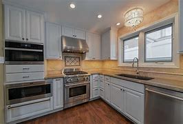 Image result for White Kitchen Cabinets with Steel Appliances