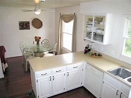 Image result for Brown Cabinets with White Appliances