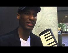 Image result for Jon Batiste Playing Melodica