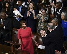 Image result for Nancy Pelosi Green Dress Orange Braclet