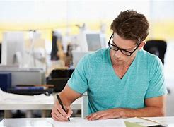Image result for Man Writing at a Desk
