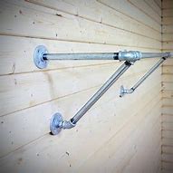 Image result for Wall Mounted Retail Clothing Racks