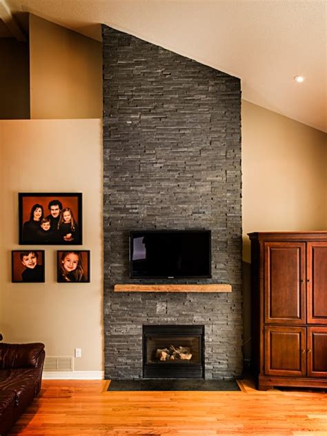 Dark Stone Veneer Fireplace with Wood Mantel   Traditional   Family  