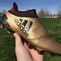 Image result for adidas black gold shoes