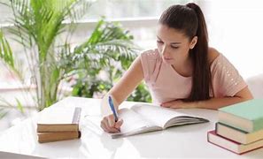 Image result for Images of a Girl Studying at a Desk