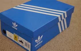 Image result for Adidas NMD R1 White and Gold