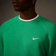 Image result for Nike Tech Fleece Orange