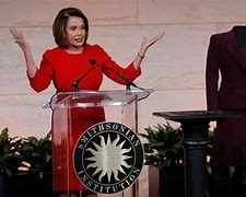 Image result for Nancy Pelosi Stands in Blue Dress