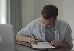 Image result for Man Writing at a Desk