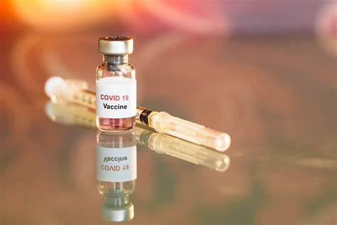COVID vaccine vial and syringe