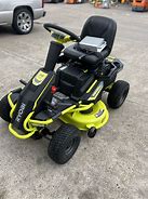 Image result for RYOBI 48V Brushless 38 in. 100 Ah Battery Electric Rear Engine Riding Lawn Mower