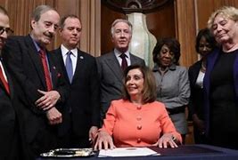 Image result for Pelosi Walking with Her Impeachment Pens