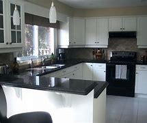Image result for White Kitchen Cabinets with Black Appliances