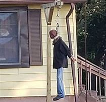 Image result for Man Hanging From Building