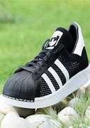 Image result for black adidas superstar sneakers