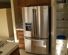 Image result for Big Freezer with Small Refrigerator