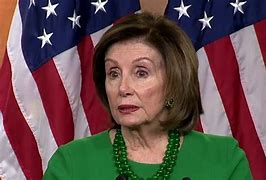 Image result for Nancy Pelosi with a Santa Hats