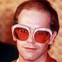 Image result for Elton John Glasses Then Vs. Now