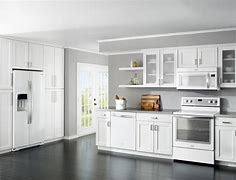 Image result for Stainless Steel Appliances with White Brick Kitchen Wood Cabinets
