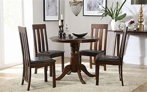 Image result for Round Dark Wood Dining Table