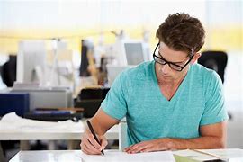Image result for Person Writing at Desk