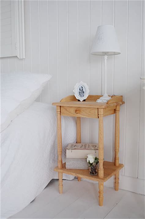 A small bedside table.   The White Lighthouse bedroom furniture