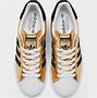 Image result for gold adidas sneakers