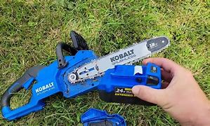 Image result for ASJMREYE Handheld Mini Chainsaw 4-Inch Cordless Portable Electric Chainsaw Pruning Shears Chain Saw For Tree Branch Wood 2Pcs Chains With Battery