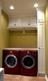 Image result for Stacked White Front Load Compact Laundry Pair With ELFW4222AW 24" Washer ELFE4222AW 24" Electric Dryer And STACKIT24C Stacking