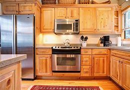 Image result for Kitchen with Black Stainless Steel Appliances Oak Cabinets