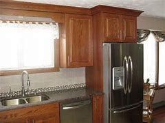 Image result for Black Stainless Steel Appliances with Oak Cabinets