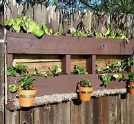 Image result for DIY Pallet Fence with Planters