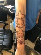 Image result for Chris Brown Kaws Tattoo