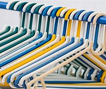 Image result for Baby Clothes in a Compartment with Hangers