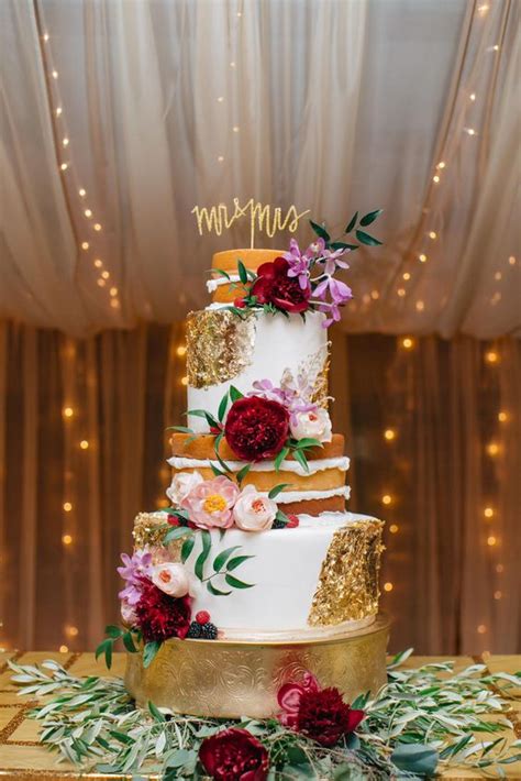 Half naked, half fondant wedding cake dressed with gold foil   Deer  