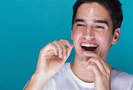 Image result for Flossing Bonded Teeth