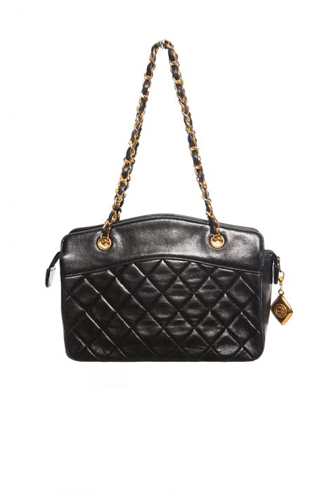 Chanel, Vintage mini black lambskin quilted handbag with gold hardware  