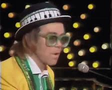 Image result for Elton John Best Outfits 80s