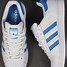 Image result for White Adidas Shoes with Blue Stripes