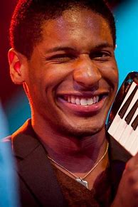 Image result for Jon Batiste Playing Melodica