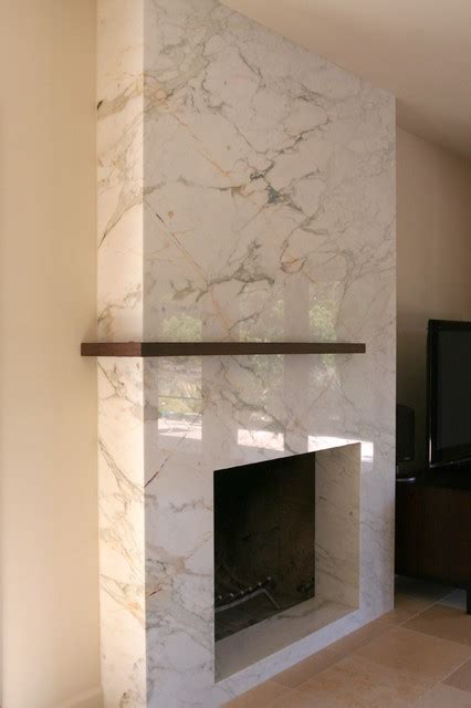 Fireplace surround made from Calacatta Classico marble